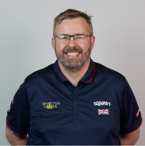 Personnel wears Invictus Games uniform in portrait.